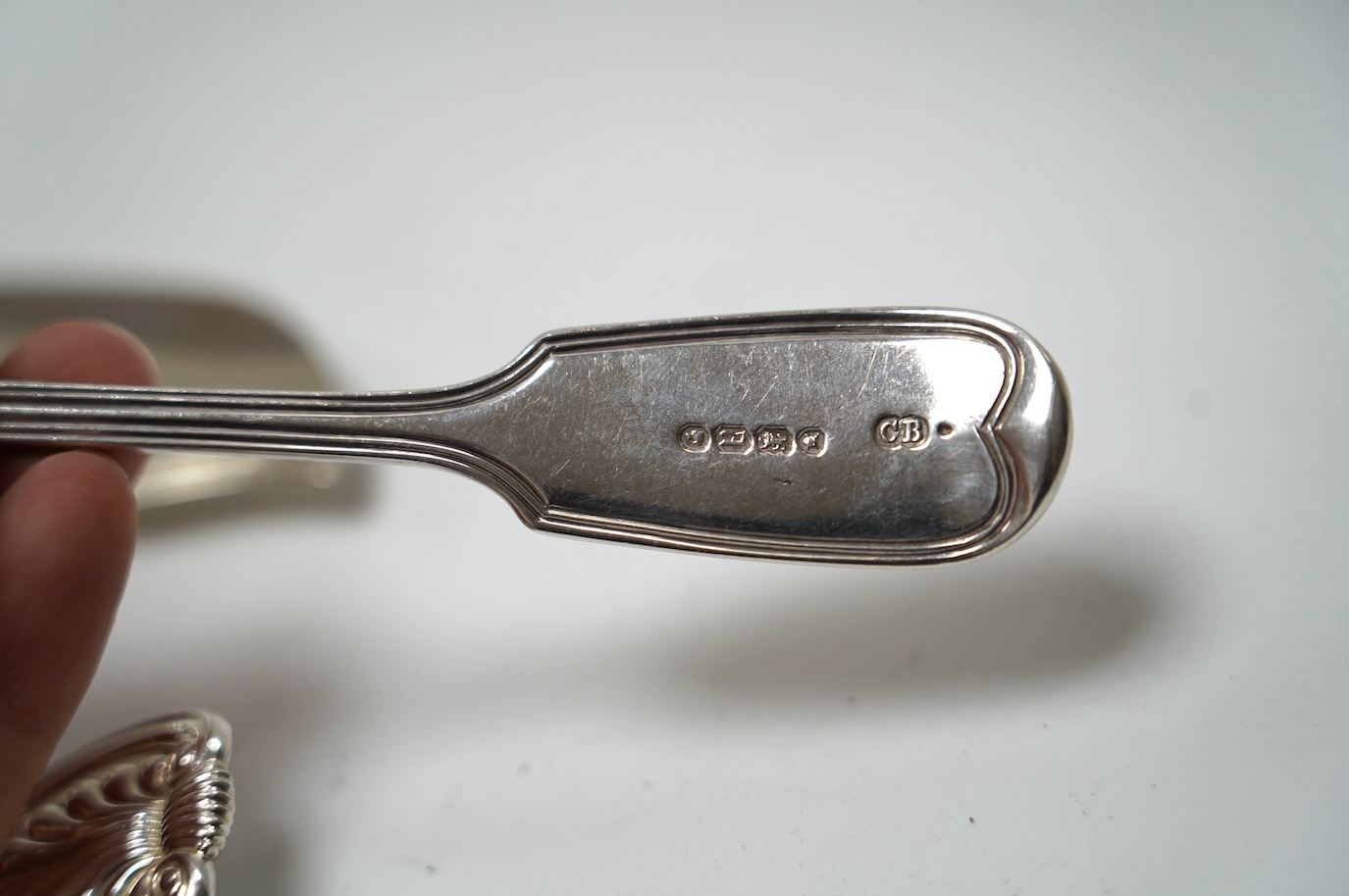 A pair of George IV silver King's pattern sauce ladles, by William Eaton, London, 1824, 17.5cm, two Victorian silver butter knives and a Victorian silver condiment spoon, 13.7cm, 10.5oz. Condition - fair to good